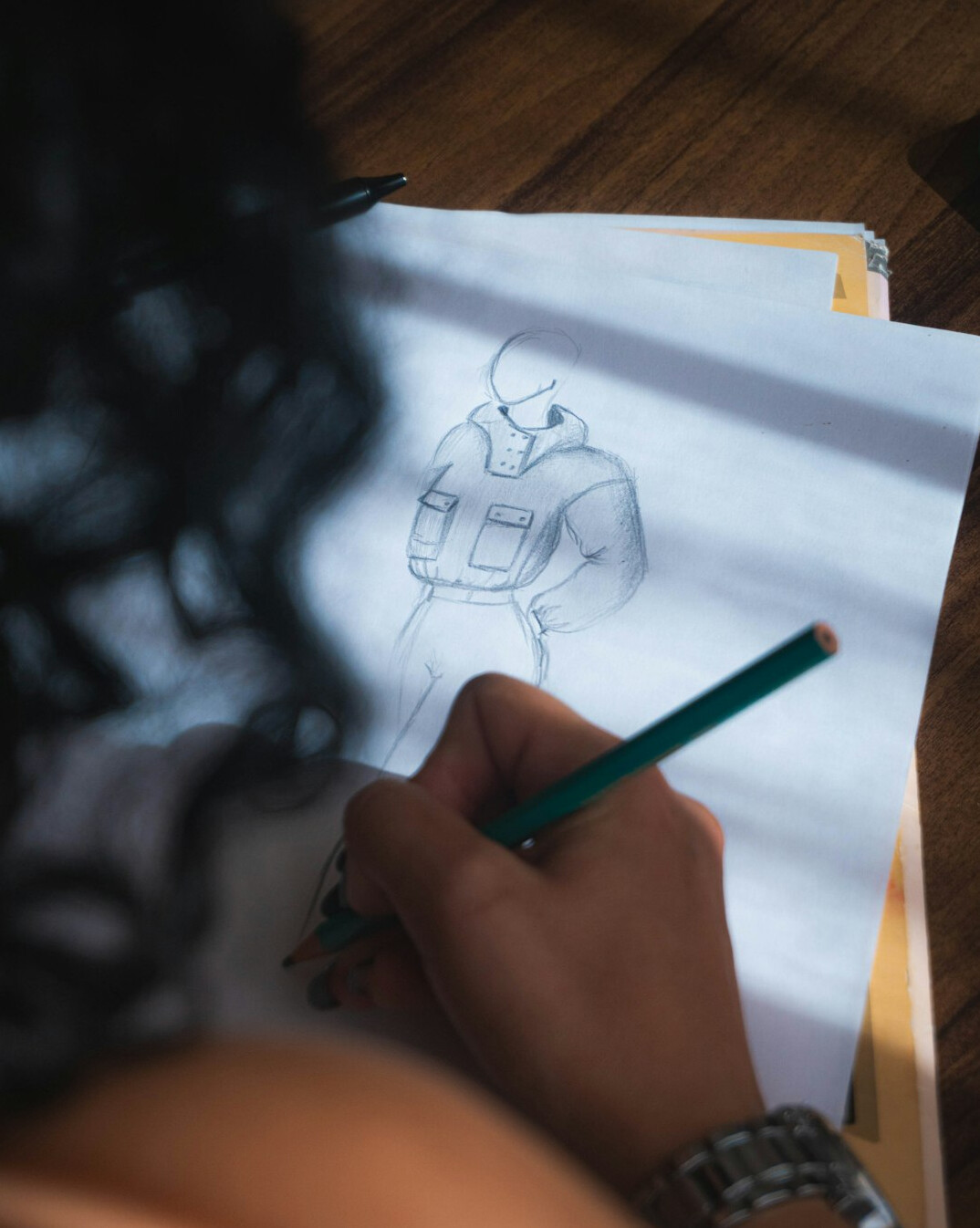 writer at desk with notebook