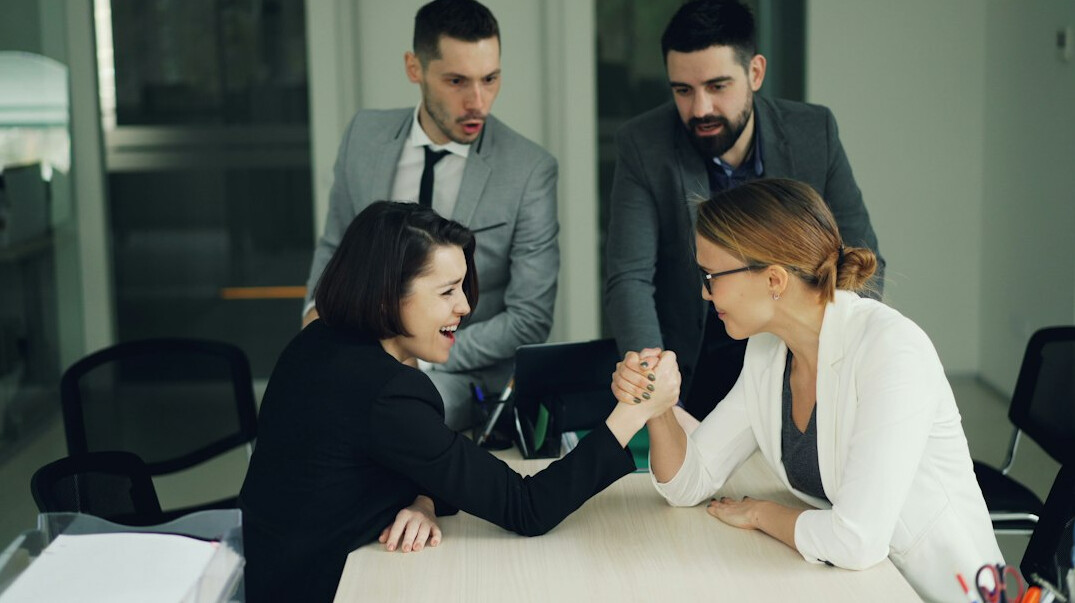 two people arguing in office